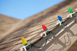 Christmas lights attached to roof with clips
